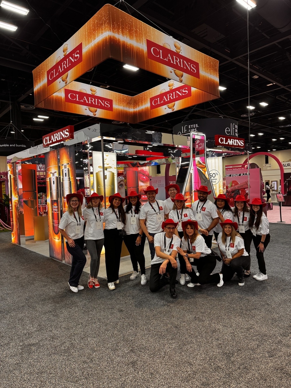 Clarins team at a trade show booth